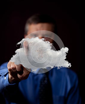 Male executive touches cloud computing symbol