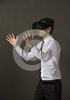 Male executive using virtual reality headset