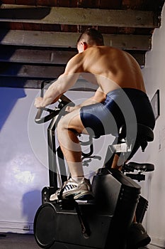 Male on exercise bike