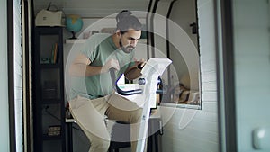 Male exercising on a bicycle in the home