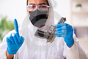 Male expert criminologist working in the lab for evidence