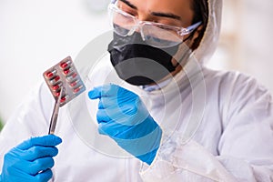 Male expert criminologist working in the lab for evidence