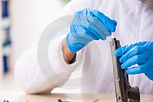 Male expert criminologist working in the lab for evidence