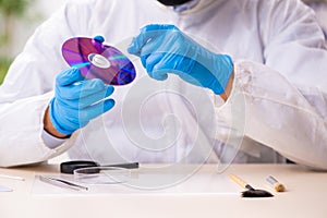 Male expert criminologist working in the lab for evidence