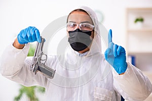 Male expert criminologist working in the lab for evidence