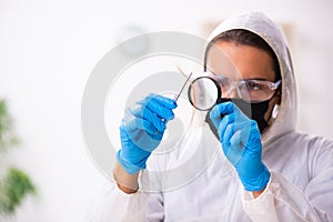 Male expert criminologist working in the lab for evidence