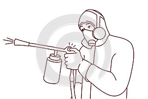 Male exterminator spraying pesticide