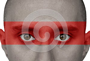 Male face, eyes close-up with the drawn national flag of Belarus, the concept of political repression, arrest, crime, civil rights