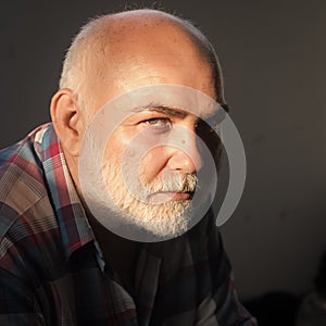 Male Face. Issues affecting boy. Senior man with grey hair beard and bold head forehead.