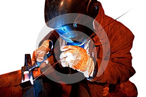 Male in face mask welds with argon-arc
