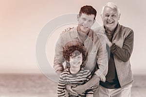 Male family members posing at the beach