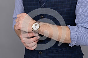 Male fashion accessory. Man with hand watch. Man showing wristwatch. Time punctuality. Men in luxury wristwatch. Luxury photo