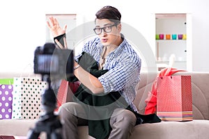 The male fashion blogger recording video for vlog