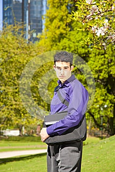 Male fashion model with a bag