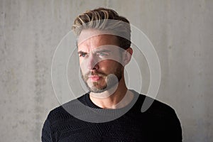 Male fashion model with beard staring