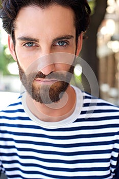 Male fashion model with beard and striped shirt