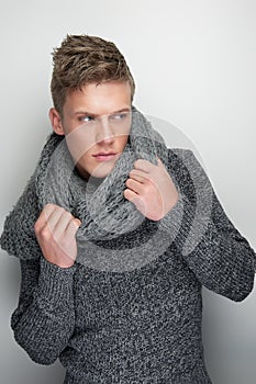 Male Fashion Model Holding Winter Scarf