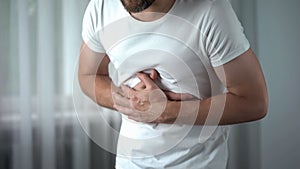 Male feeling stomach pain at home, gastritis symptom, peptic ulcer, pancreatitis
