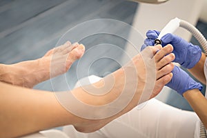 Male feet hardware pedicure using electric machine