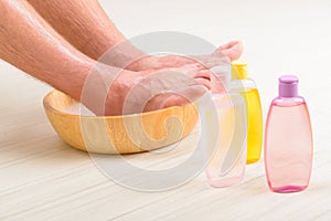 Male feets in a bowl