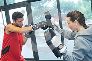 Male and female boxer with fighting stance