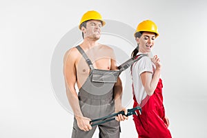 Male and female builders posing