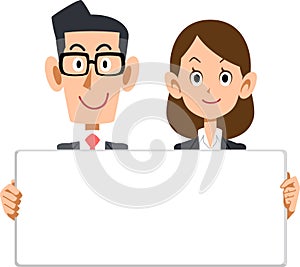 Male and female business people with whiteboards