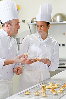 male and female chefs prepping pastries