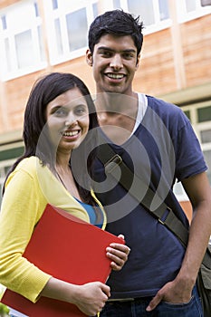 Male and female college students on campus