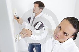 male and female decorating team working together photo