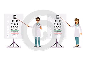 Male and female doctors standing near eye test chart