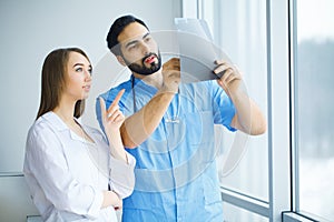 Male and female doctors work together in hospital