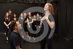 Male And Female Drama Students At Performing Arts School In Studio Improvisation Class photo