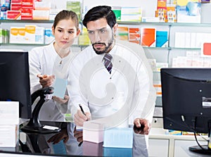 druggists are attentive stocktaking medicines photo