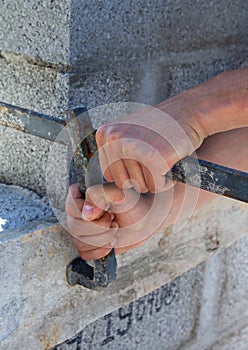 Male and female hands with building materials