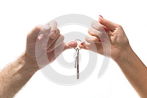 Male and female hands hold a bunch of keys.