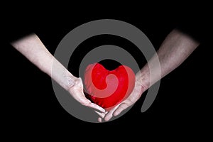 Male and female hands holding heart Valentine`s day