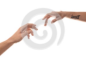 Male and female hands reaching out to each other on white background