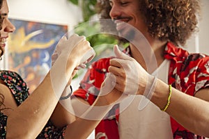 Male and female hands while salsa dancing