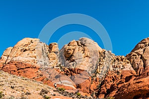 Male and Female Hikers Hiking Over Sandstone Slickrock