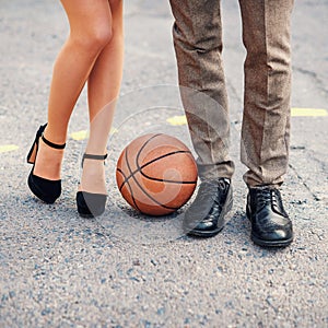 Male and female legs at basketball court