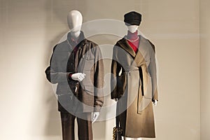 Male and female mannequins in a shop window. Stylish new collection for the autumn-winter season
