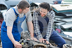 male and female mechanics outdoors