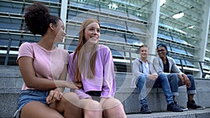 Male and female millennials looking each other outdoors, first romantic sympathy