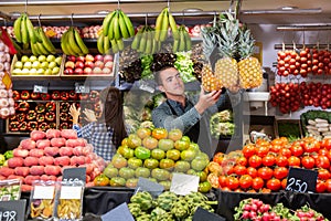 Two sellers laying out vegetables photo