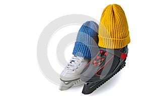Male and female skates in knitted winter hats isolated on white background. Romantic date on the ice rink