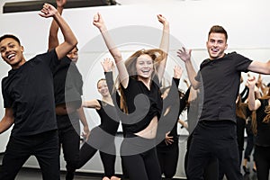 Male And Female Students At Performing Arts School Rehearsing Street Dance In Studio