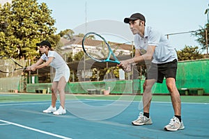 male and female tennis players ready to receive the ball