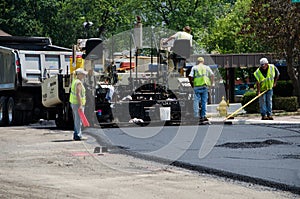 Workers Repaving a road