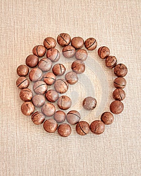 The male and female Yin-Yang symbol is made of macadamia nuts